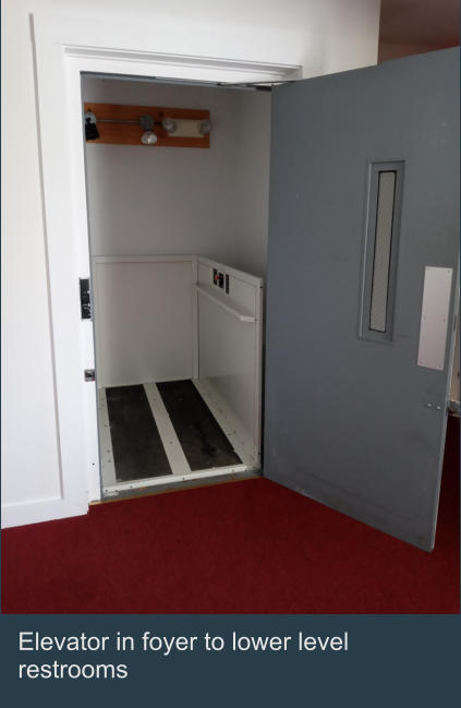 Elevator in foyer to lower level restrooms